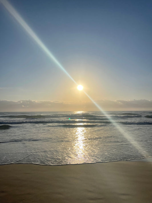 First light whispers its secrets to the waves...