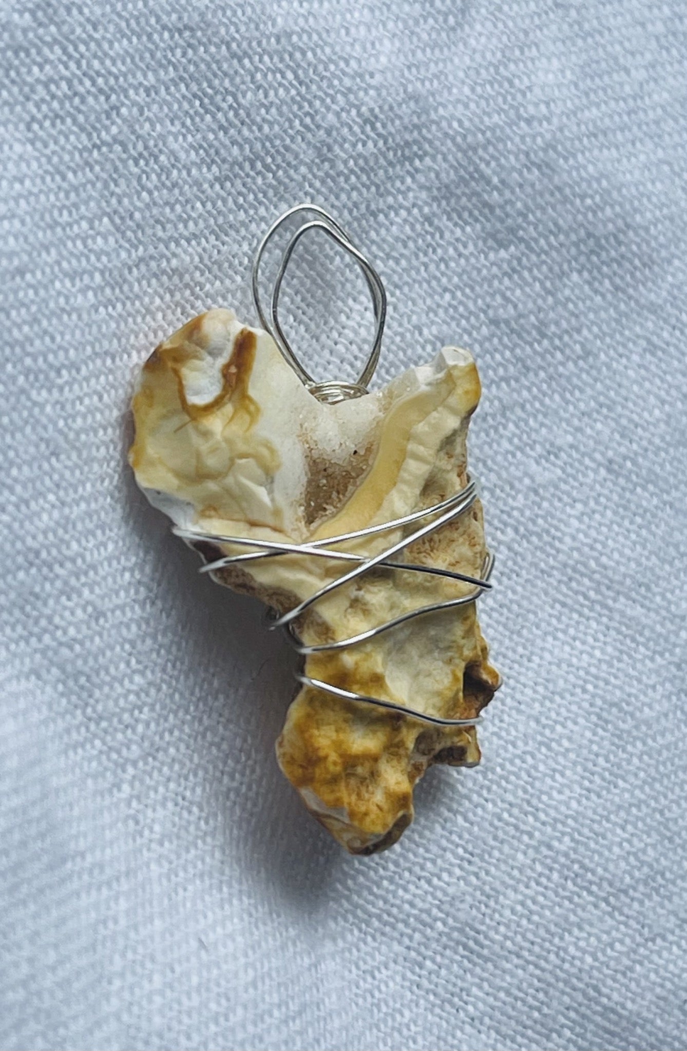 Geometrically fascinating golden-textured geode pendant.