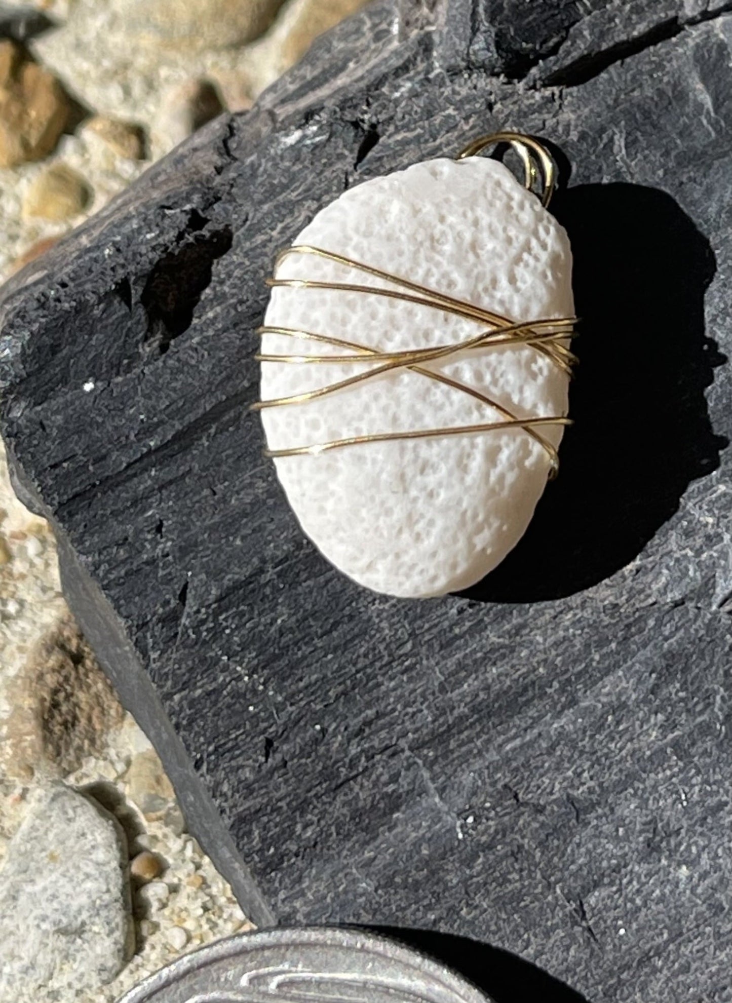 Delicate white pendant with sparkly highlights