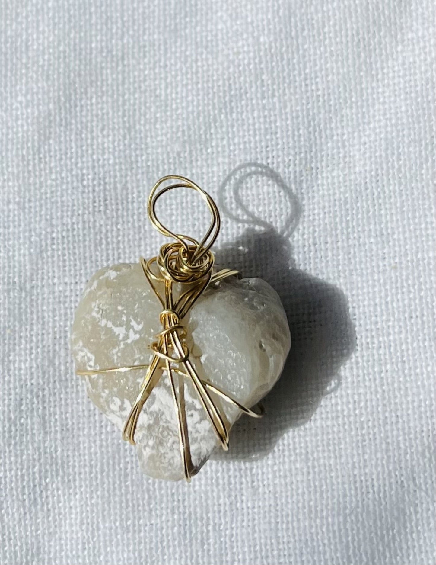 Loveheart-shaped alien glass pendant with unique texture
