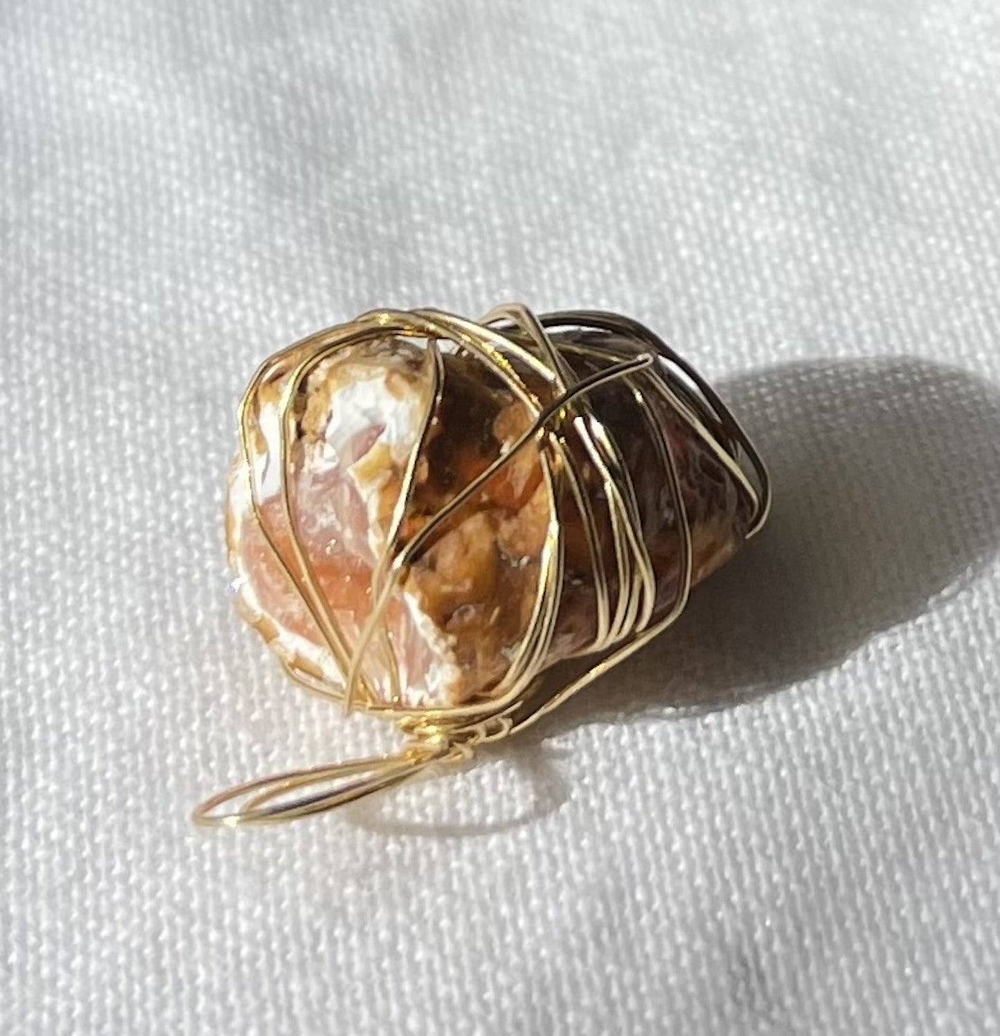 Pink geode pendant with striking natural tones