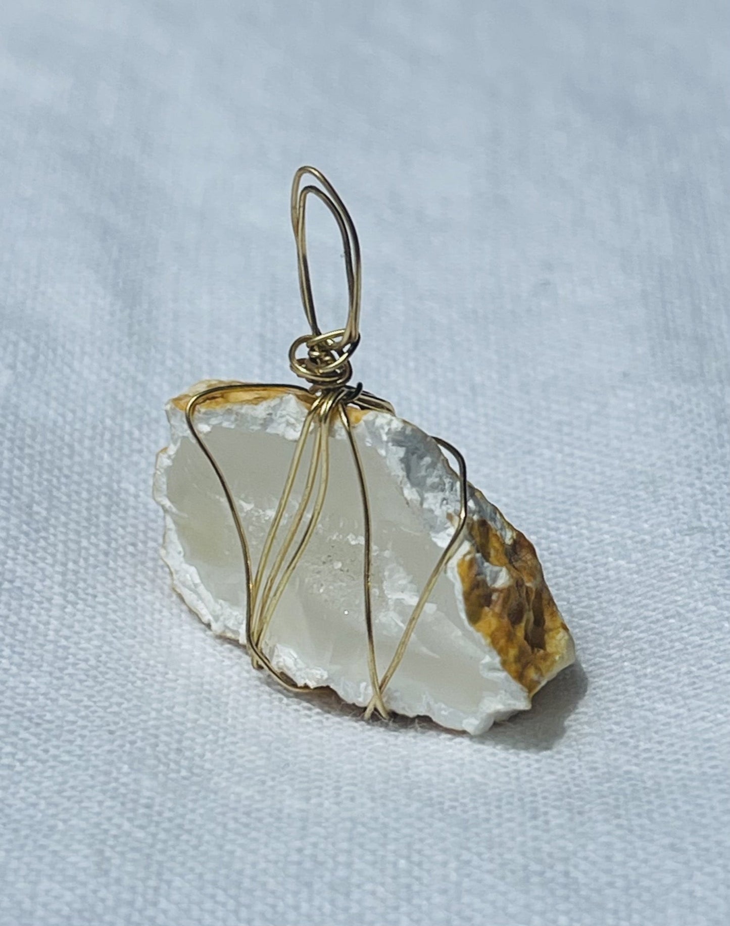 Pure white agate pendant with honey edges