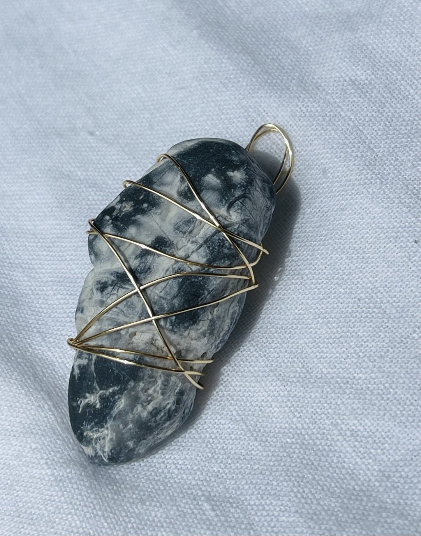 Honey-sparkle Wise Rock charm wrapped in gold-coloured wire