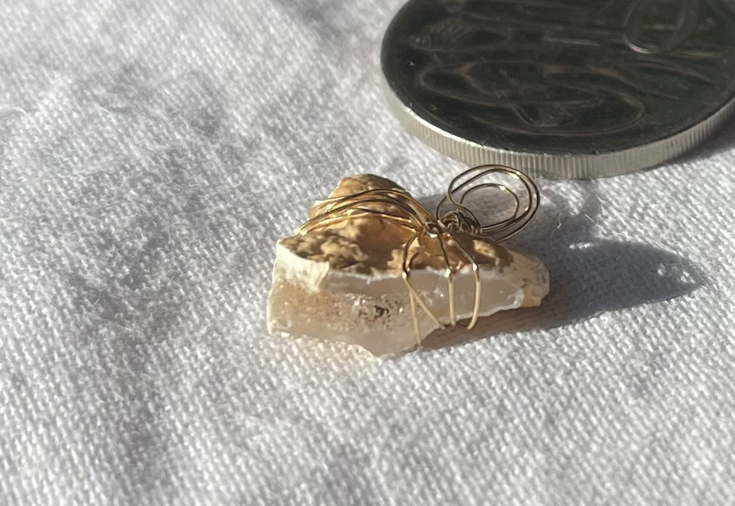 Heart-shaped pendant with brilliant sparkles and symbolic design