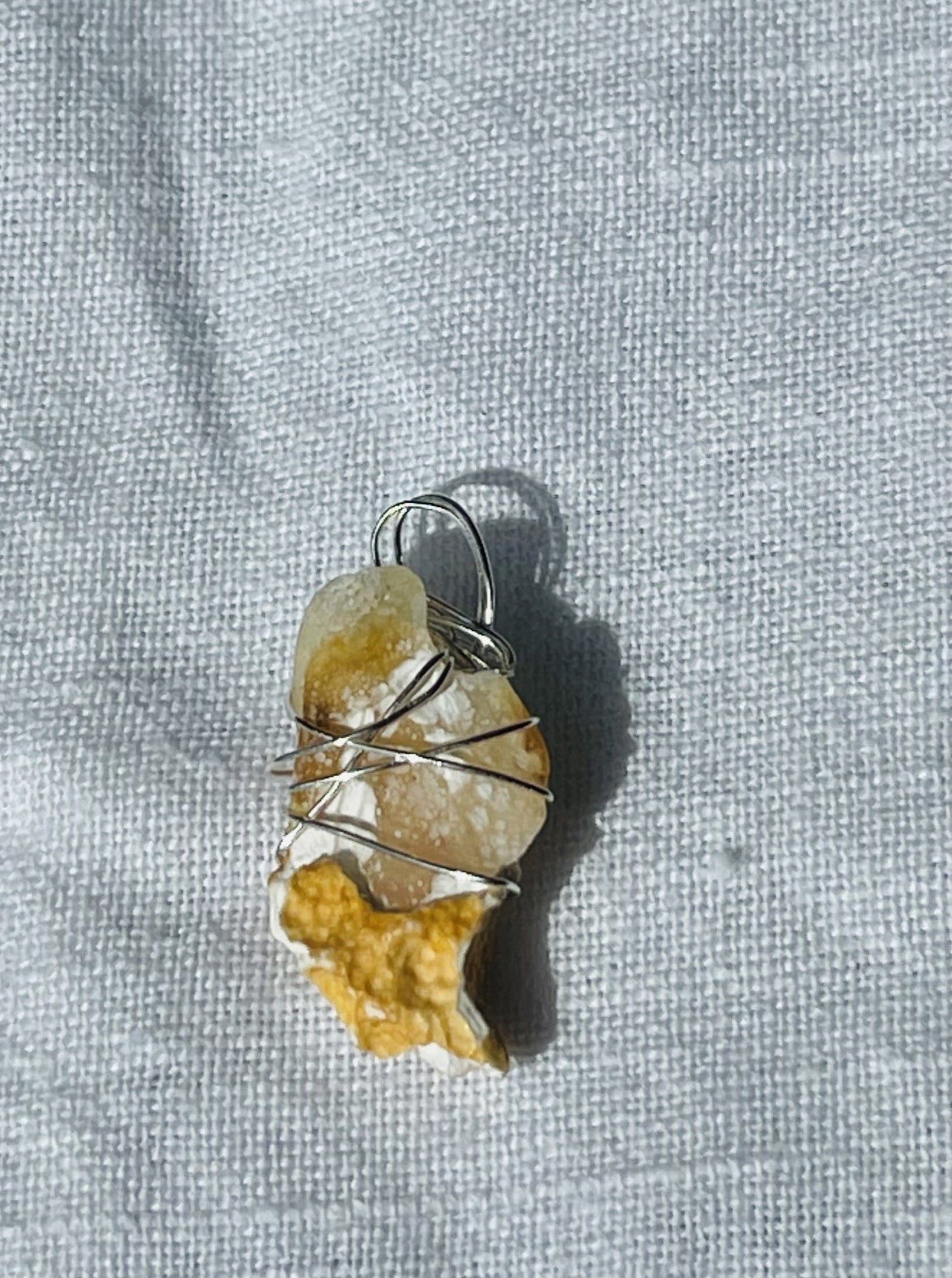 Sparkly Geode Yellow Pendant - Warm golden hues with a sparkly geode focus, wrapped in silver-coloured wire.