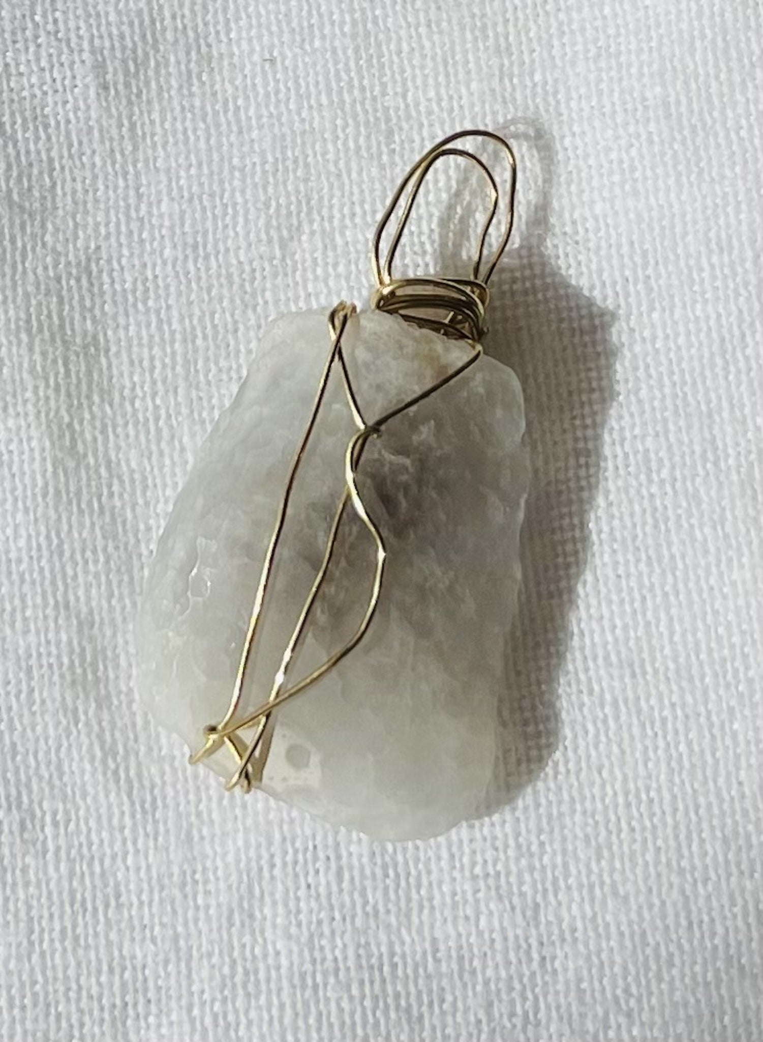 Translucent charm with shadowed designs